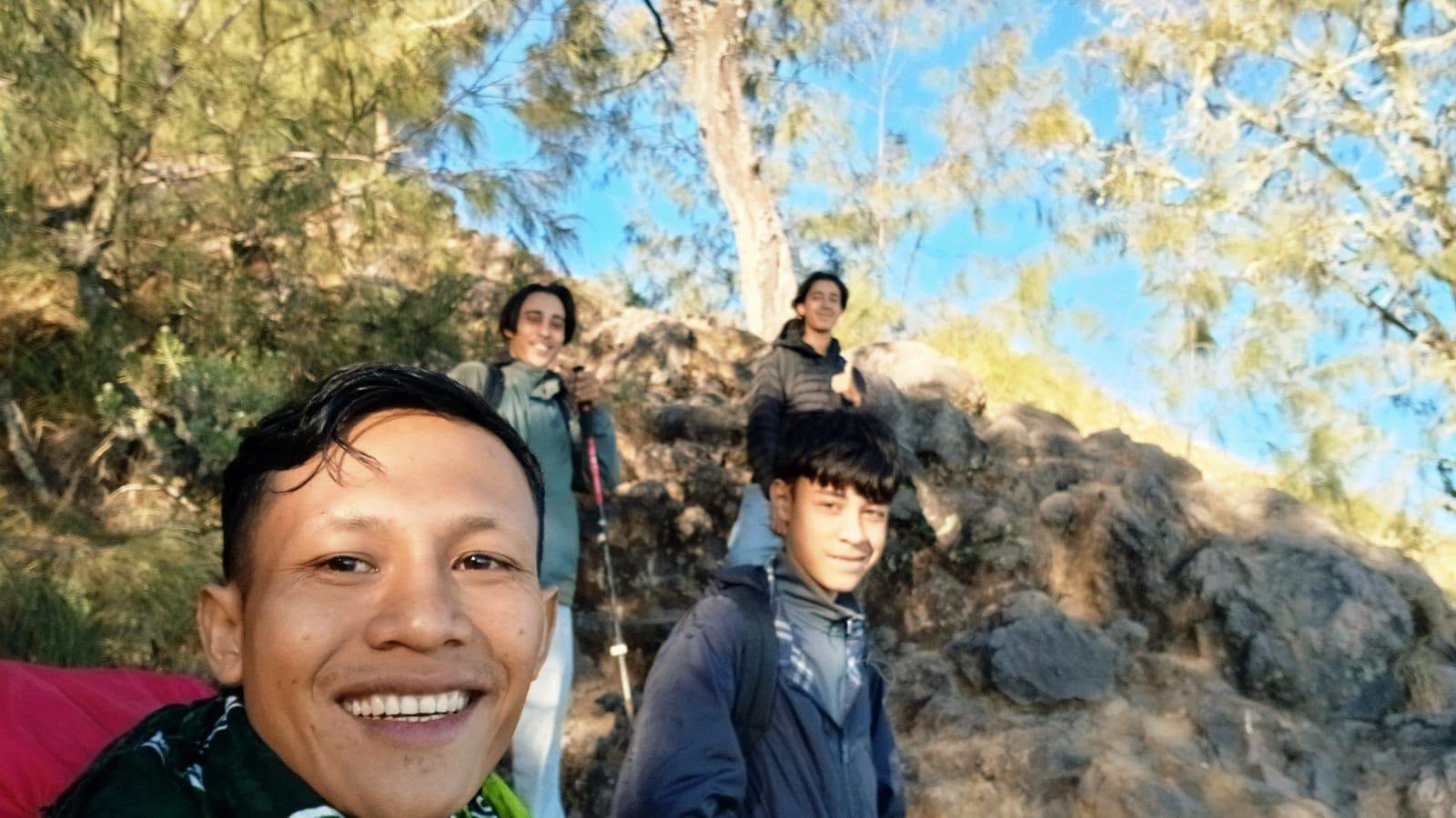 Local guide and trekkers on the trail
